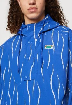 HUF New Day Packable Anorak Unisex - Waterproof Jacket - Blue -Modern Classic Shoes Store aeb3296ea7c747aca2f1d5c530a212de